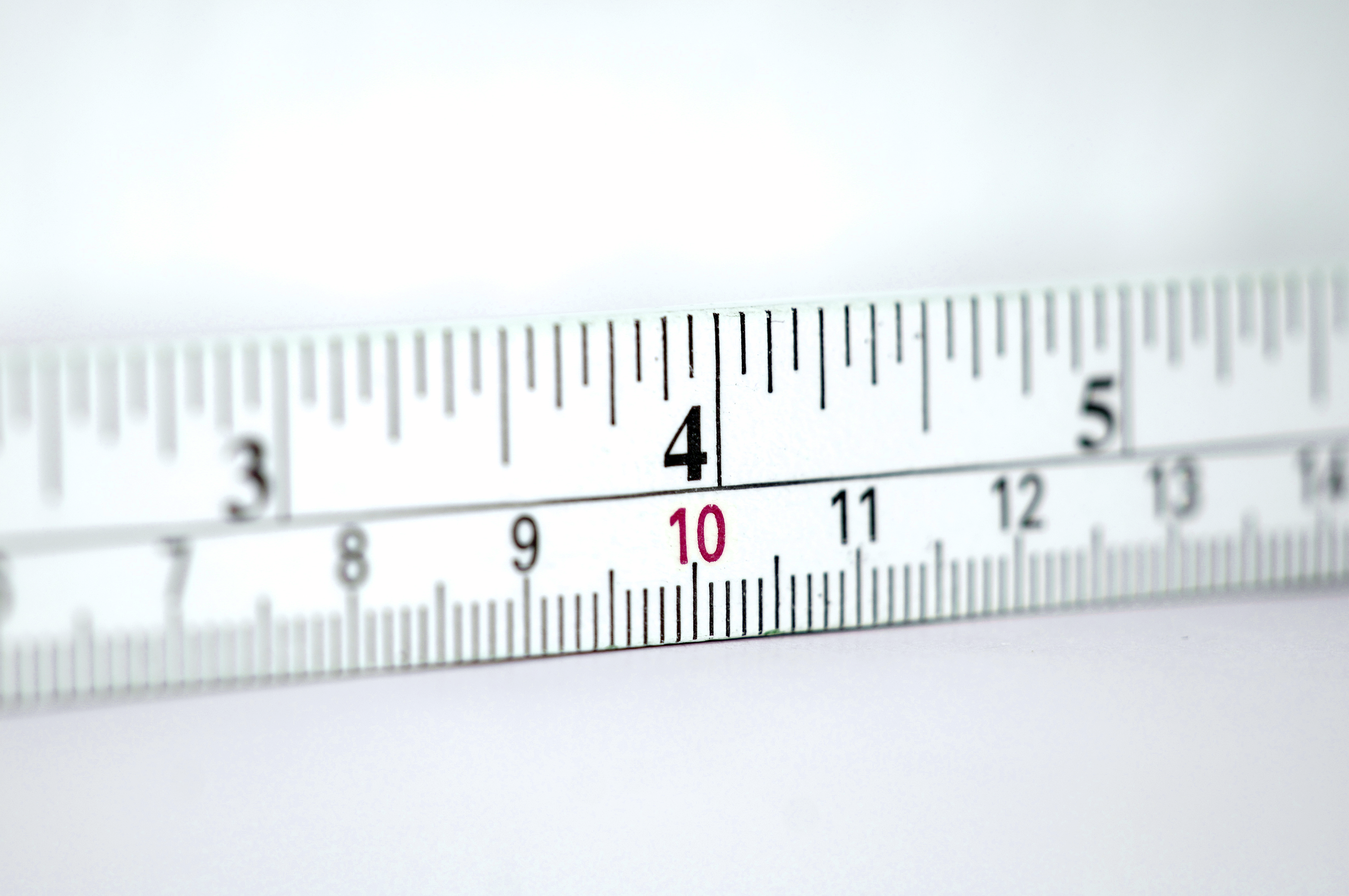 Folding metre stick with units centimetres and inches